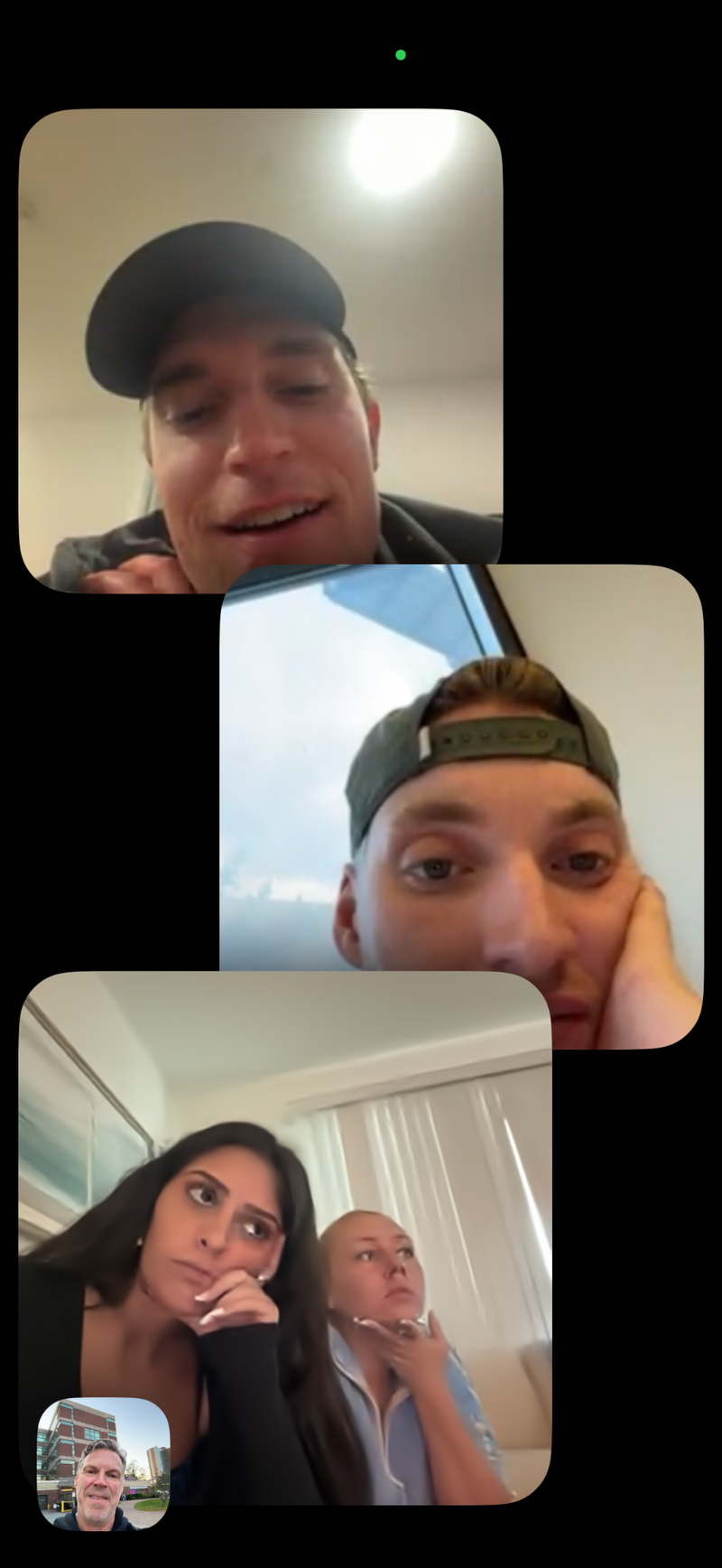 Dr. Darren Burke on a group FaceTime call with the Headstrong social media team while walking his dog.
